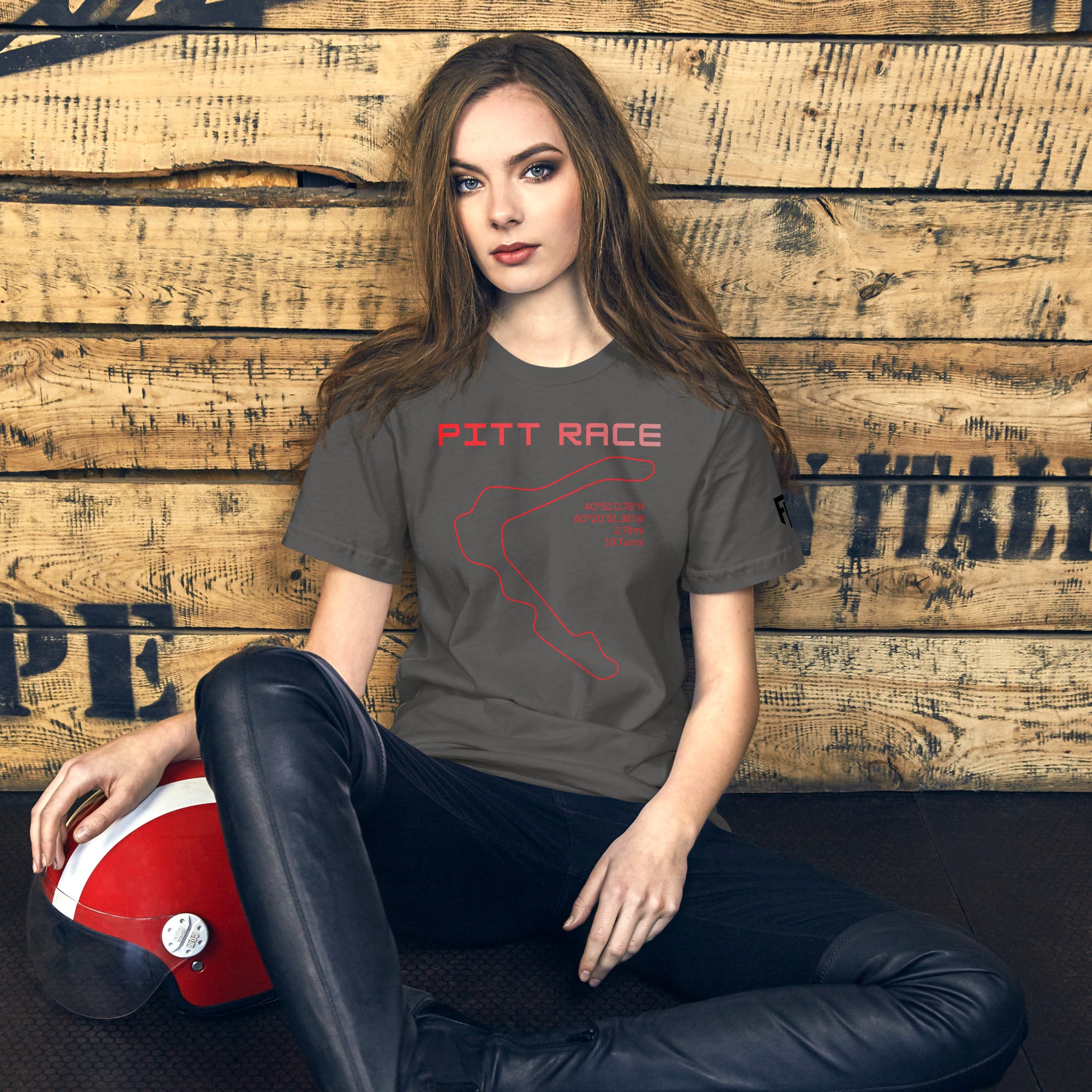 Tee shirt featuring the now closed Pittsburgh National Raceway featuring a simple one line design of the track in red with the track location, length, and number of turns with text above that says "Pitt Race"