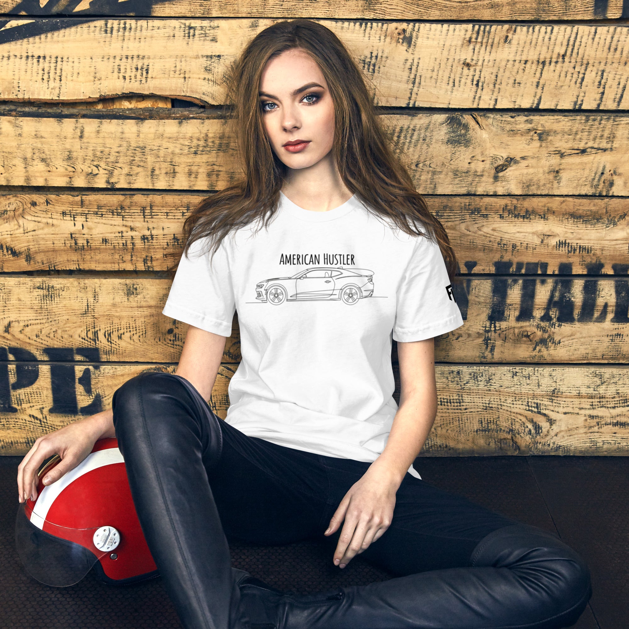 Tee shirt with a simple one line design of a 6th Gen American, muscle car with Text American Hustler over top.