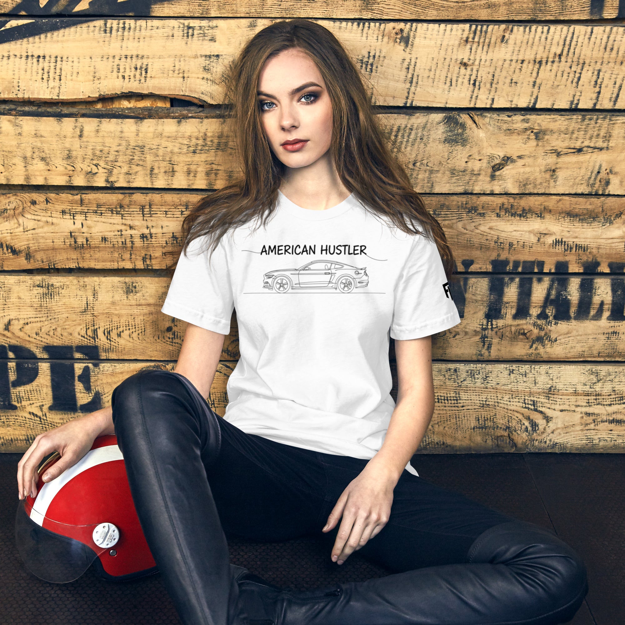 Tee shirt with a simple one line design of an S550 American sports car with Text American Hustler over top.